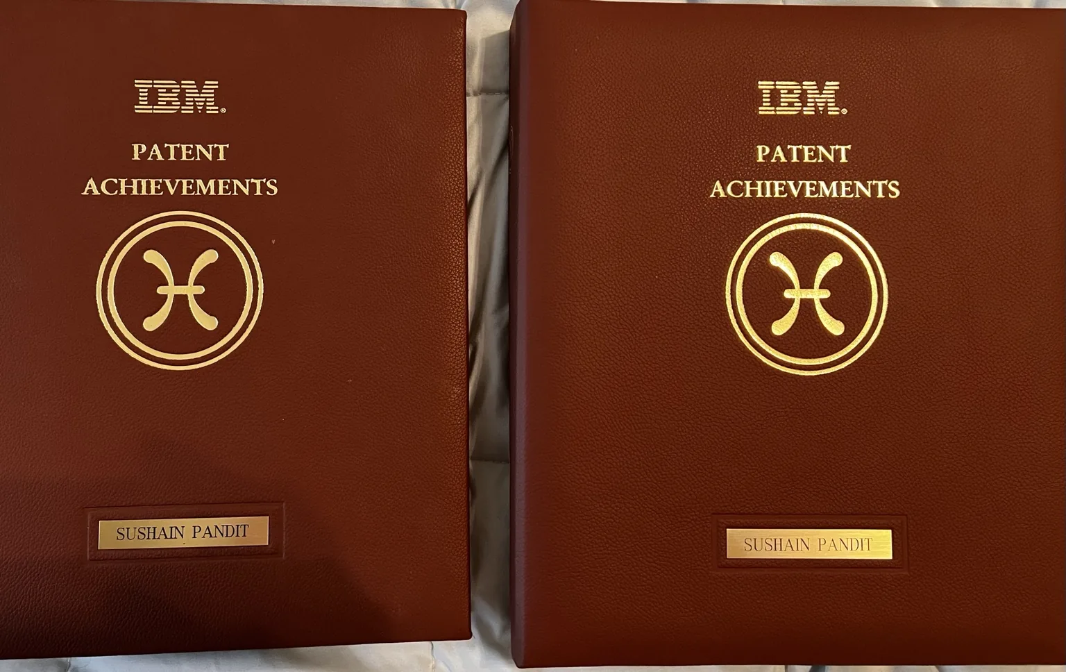 Two IBM Patent Achievements binders with Sushain Pandit's name